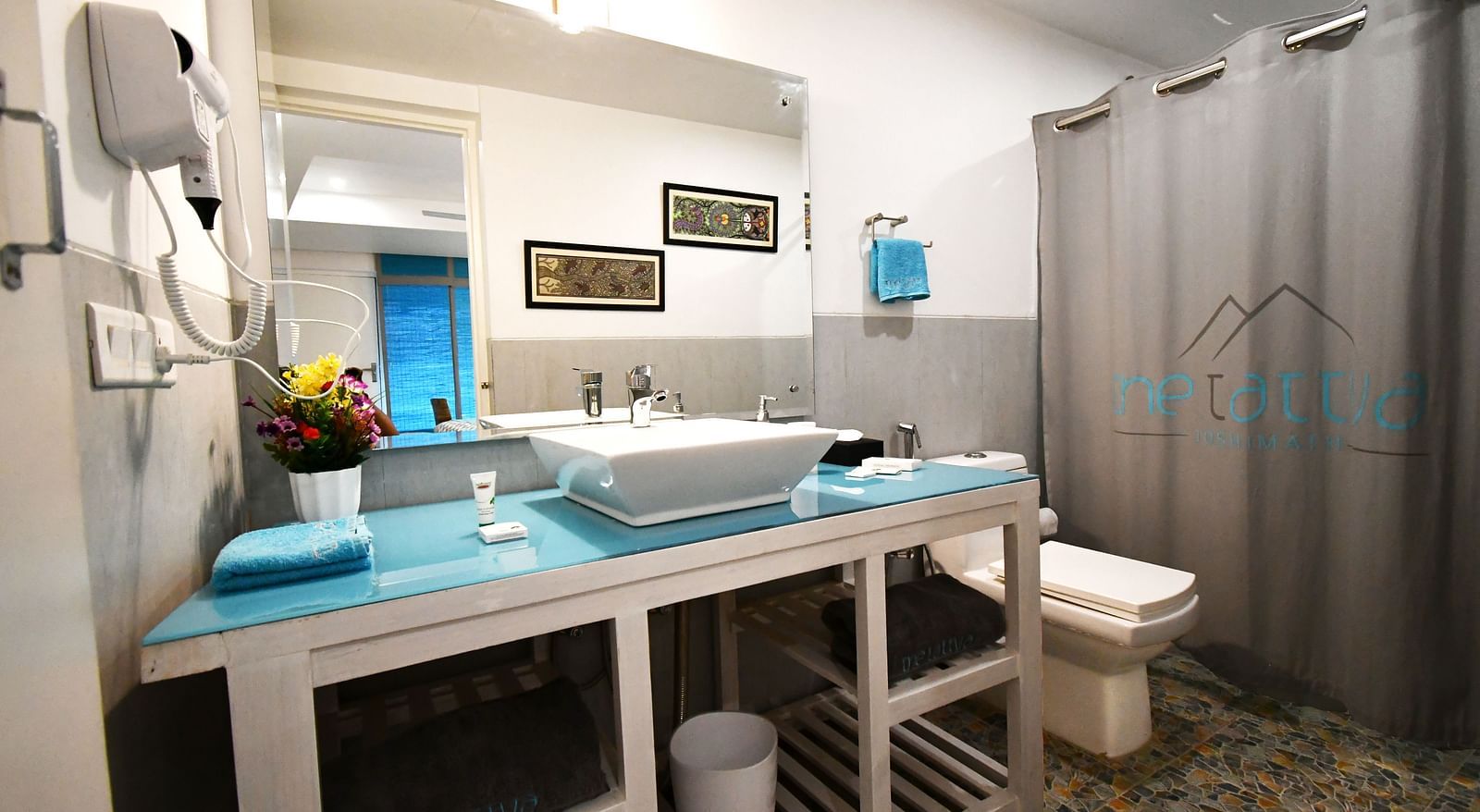 image of a well appointed vanity area in the bathroom of the premium room - The Tattva Boutique Resort