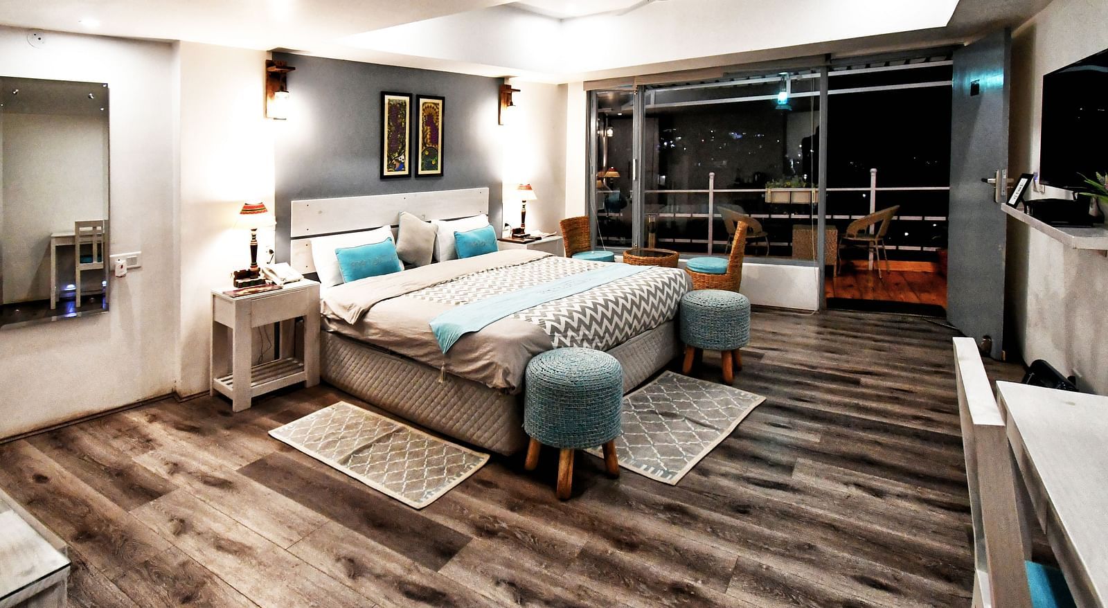 corner view image of  the premium room during the night with modern interiors - The Tattva Boutique Resort