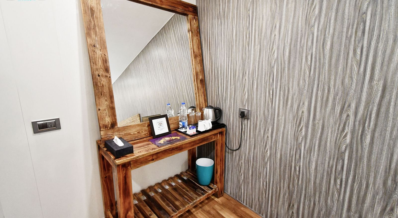image of a dressing table with a square shaped mirror in the standard room - The Tattva Boutique Resort