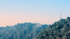 view of the sun setting behind the hills of Kasauli