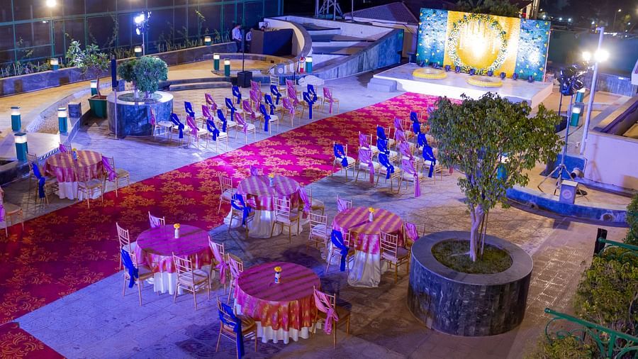 Outdoor event space with vibrant red carpet at The Orchid Hotel Mumbai Vile Parle