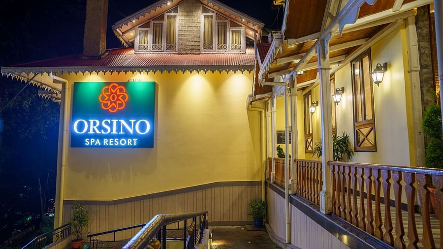 The exterior of Orsino Spa Resort with warm lighting and visible architectural details.