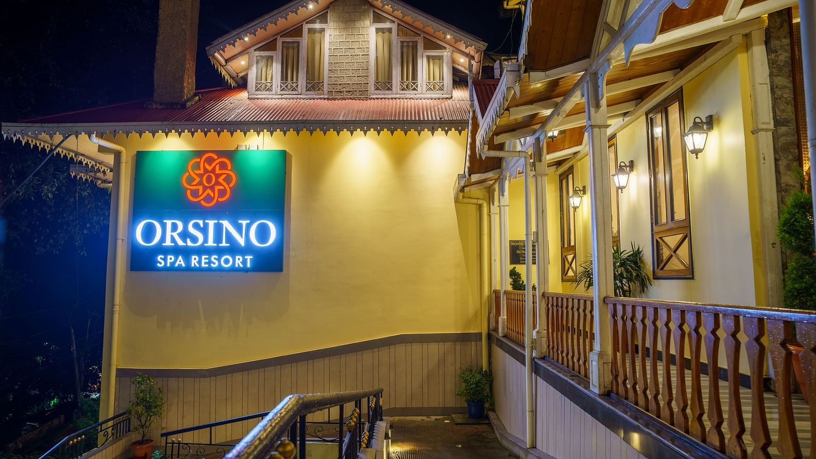 The exterior of Orsino Spa Resort with warm lighting and visible architectural details.