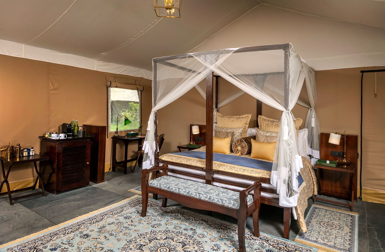 An image of a bed in our colonial themed tents in Haridwar - Aalia Jungle Resort & Spa