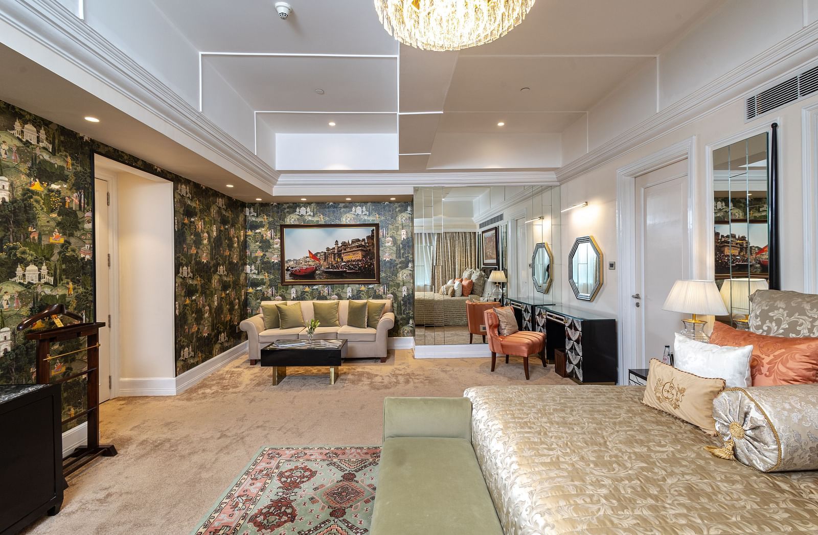 Presidential Suite at The Claridges New Delhi, featuring a spacious room with a cosy couch and elegant ambient lighting