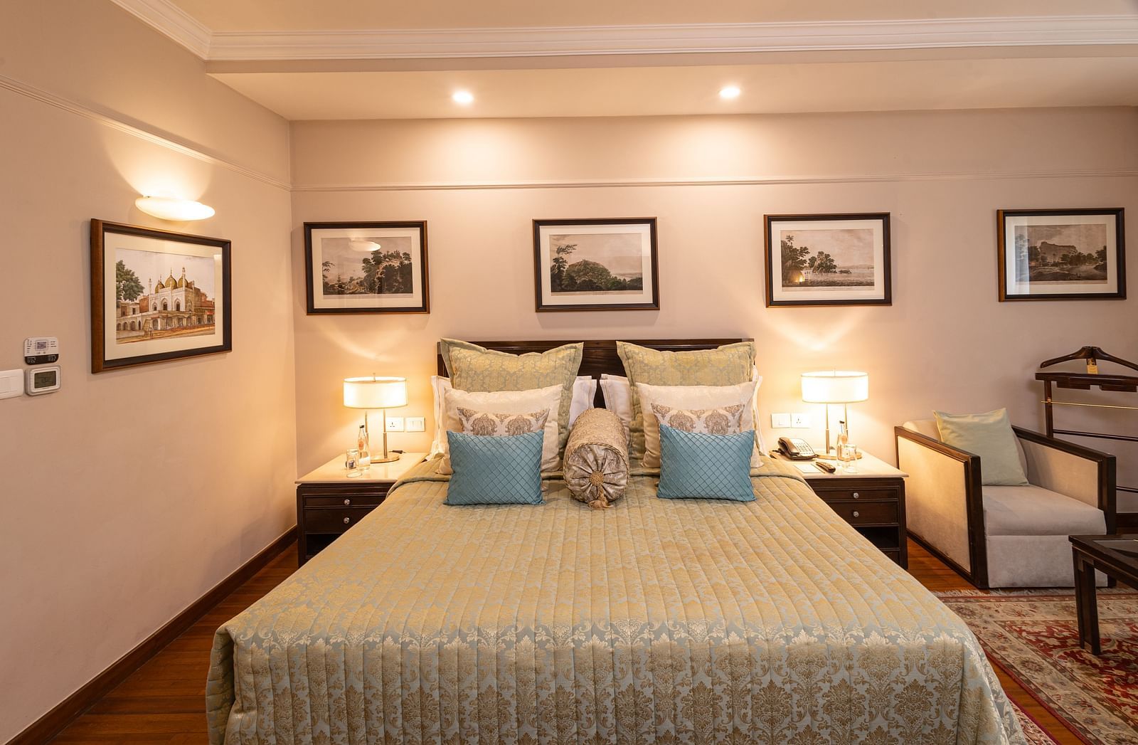 image of the boutique room featuring a king size bed with well kept pillows on it - The Claridges New Delhi