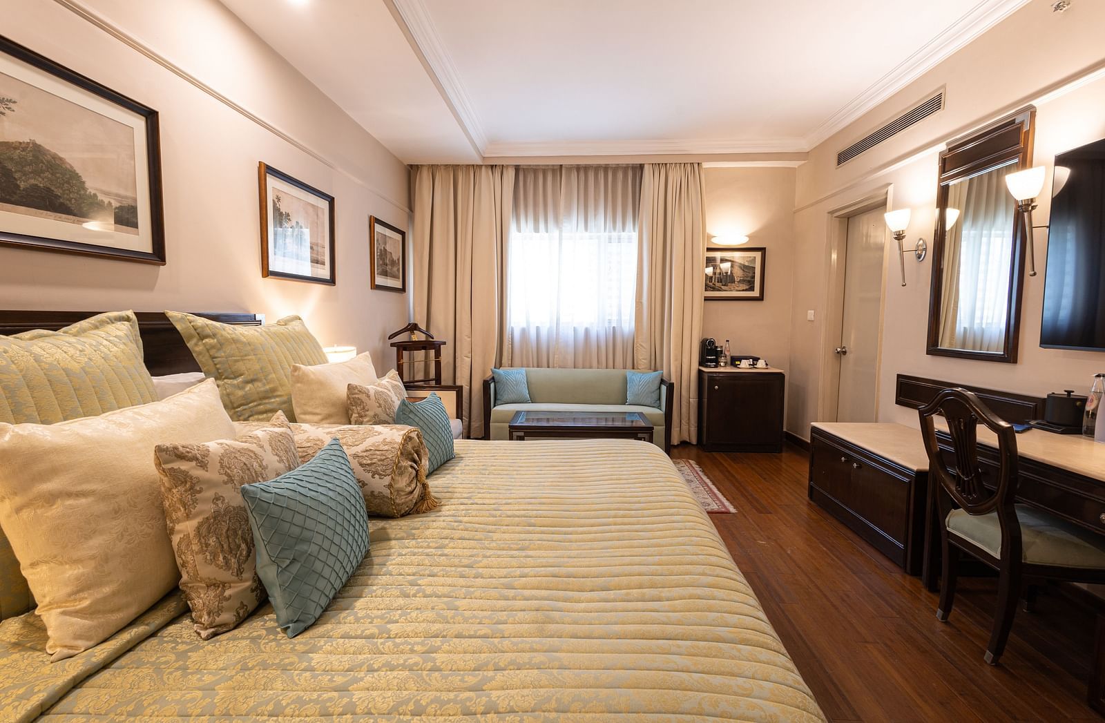 Image of a large bedroom featuring a king-size bed in our boutique rooms - The Claridges New Delhi