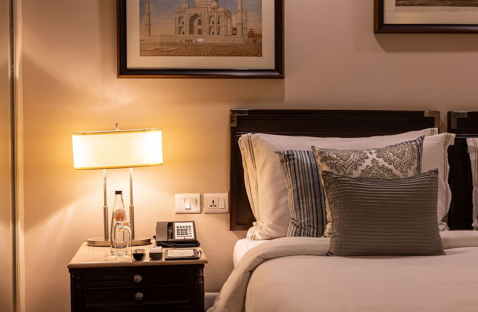 Superior Twin Bed Room at The Claridges New Delhi, featuring a pillow on the bed and a bedside lamp