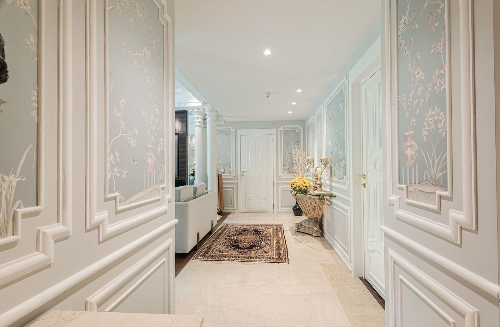 image of the lobby at our Diplomatic Suite rooms with a carpet on the floor - The Claridges New Delhi