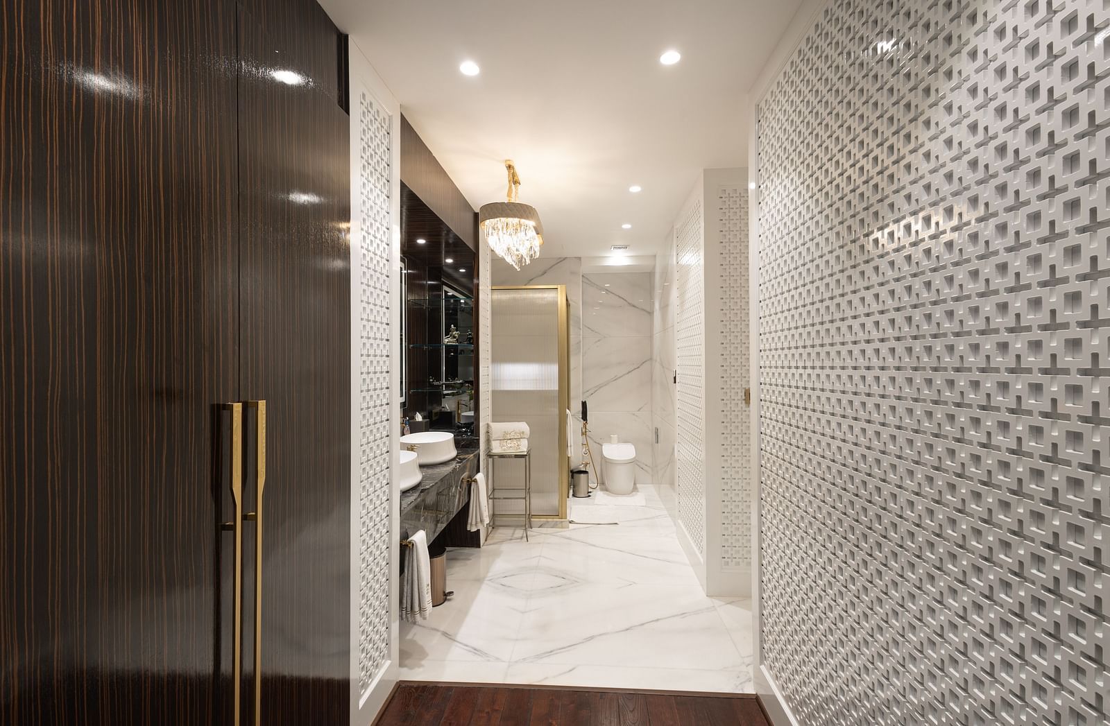 image of the washroom at the Diplomatic Suite room with a brown cabinet in the corner - The Claridges New Delhi