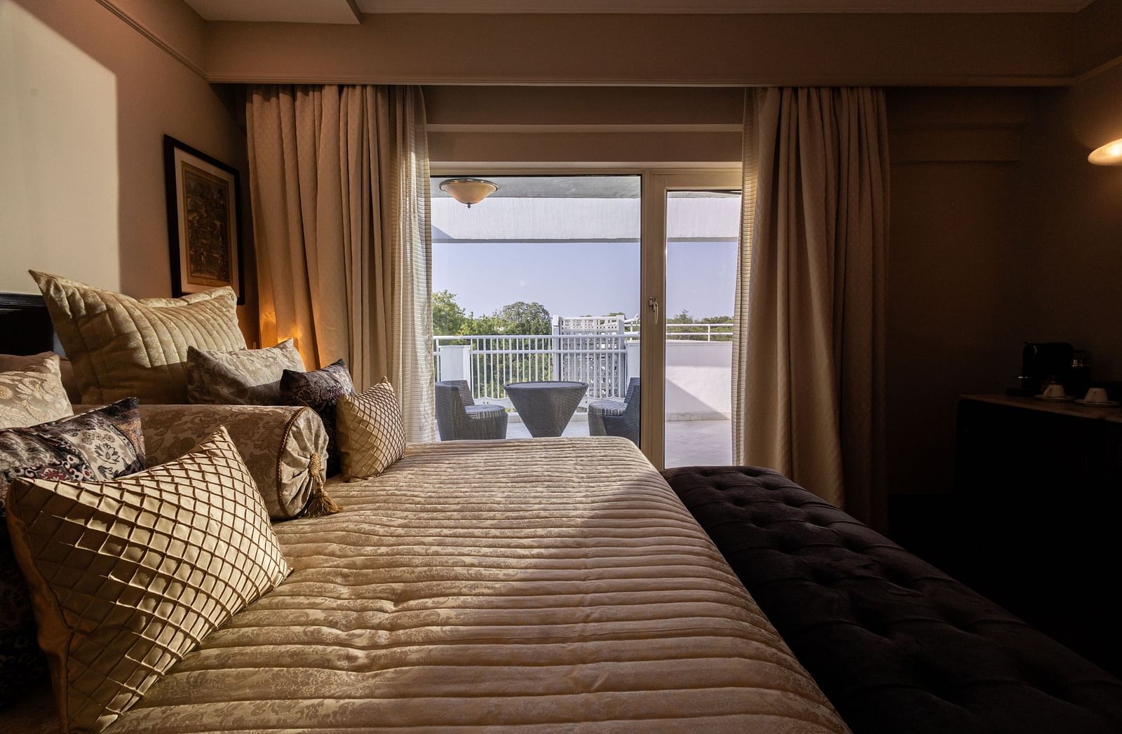 a beautiful image of the of heritage terrace room with natural light coming from the french windows - The Claridges New Delhi
