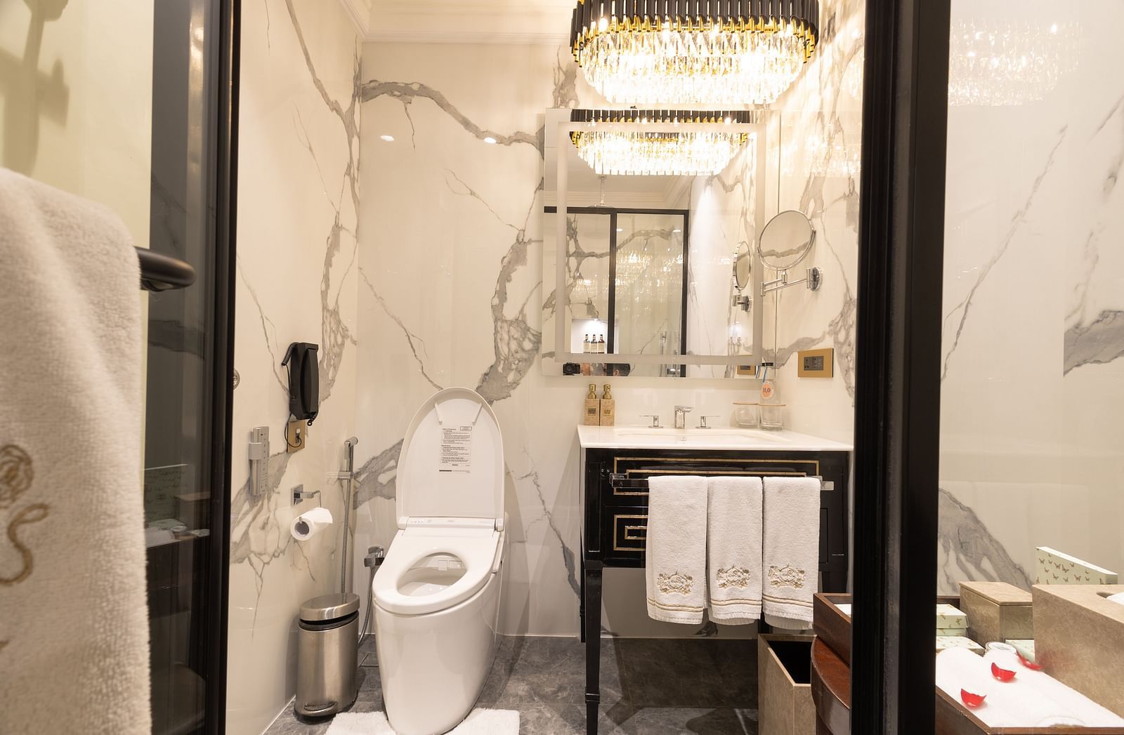image of the a compact yet elegant bathroom with all the necessary amenities - The Claridges New Delhi