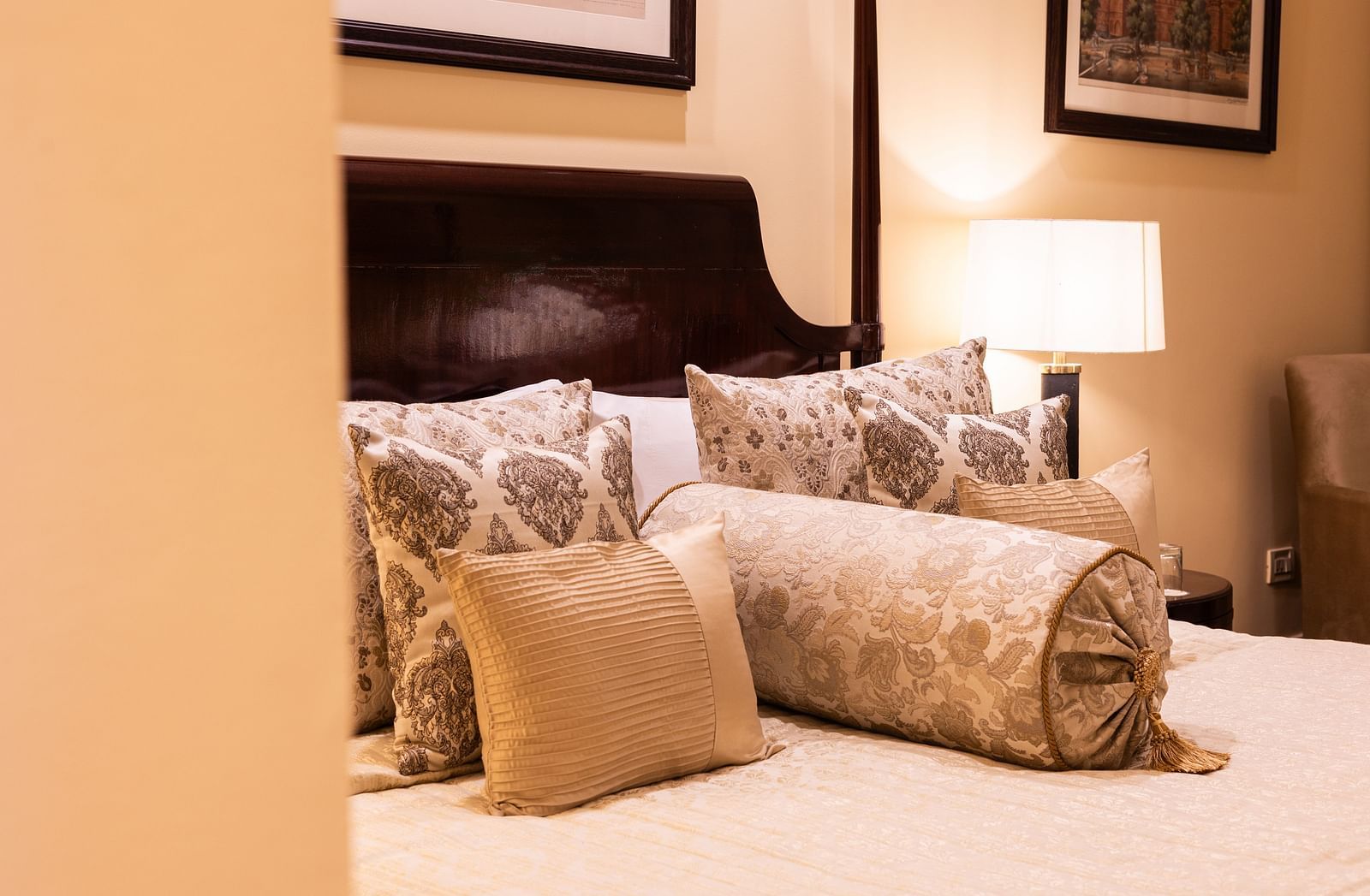 pillows and cushions are kept well on the king size bed at our heritage parlour rooms - The Claridges New Delhi