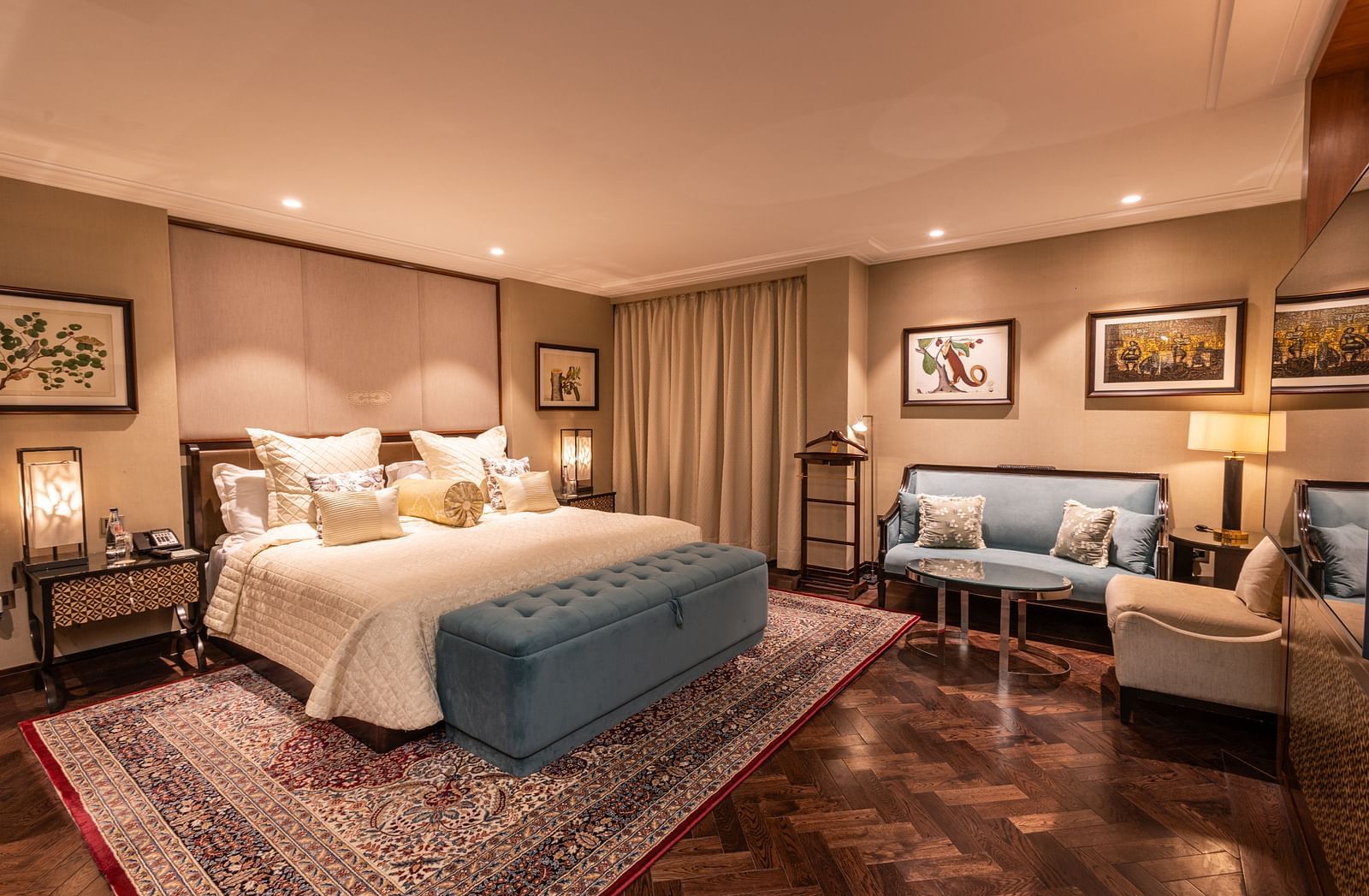 Full view image of the Cabana Room showcasing the king-size bed, seating area, and elegant interiors - The Claridges New Delhi