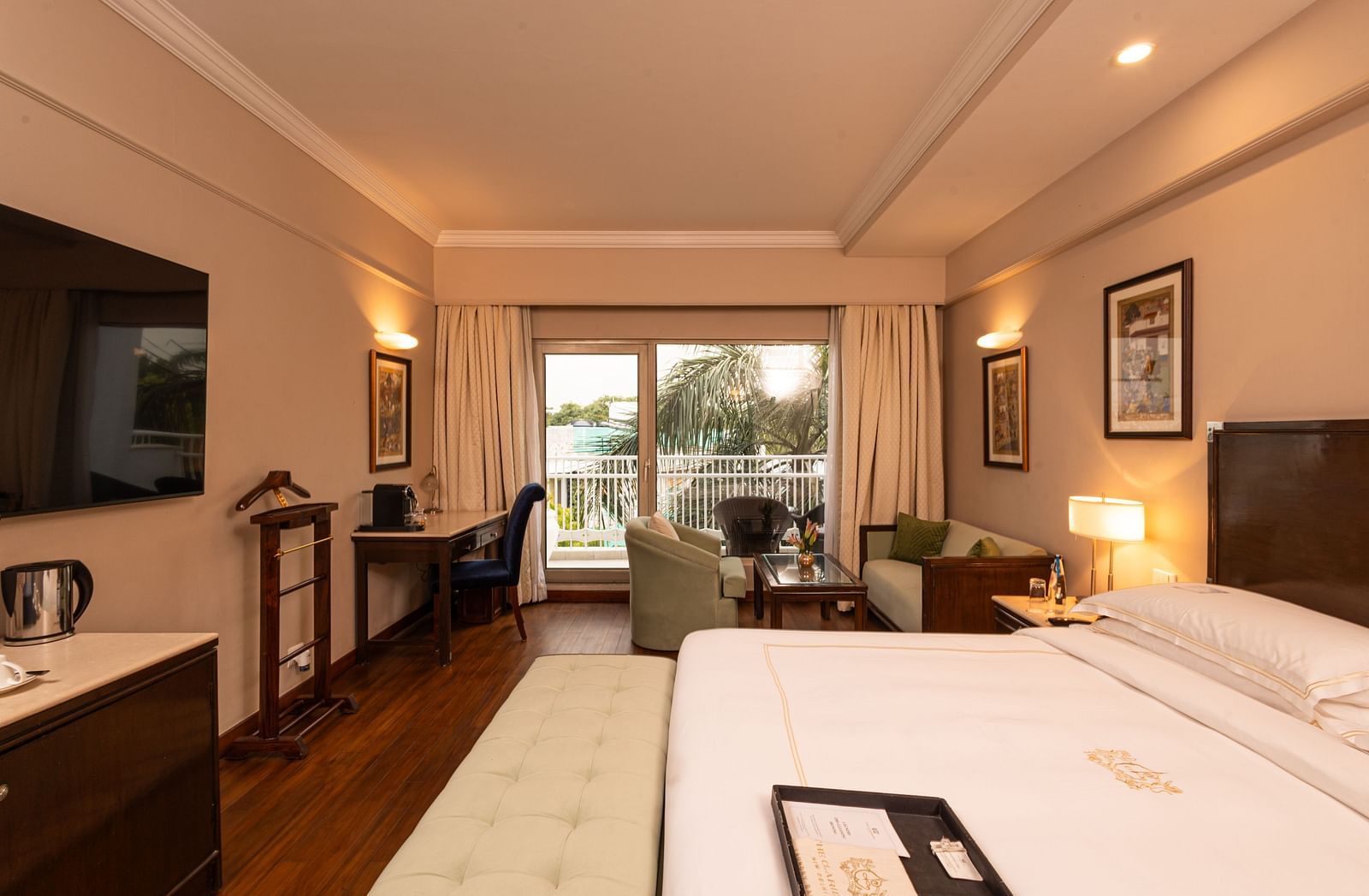 image of the heritage balcony room with sleek interiors and a a plush king size bed - The Claridges New Delhi