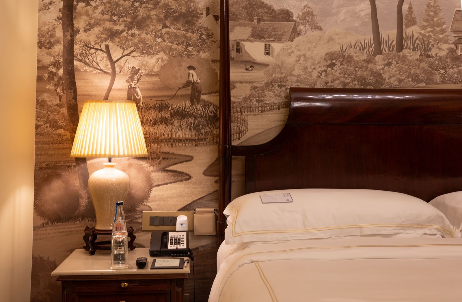 closeup image of the side table of our heritage room with a table lamp - The Claridges New Delhi