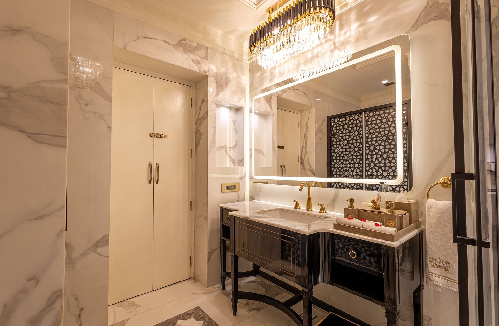 image of the well appointed vanity area along with a mirror with border lighting at the heritage room - The Claridges New Delhi