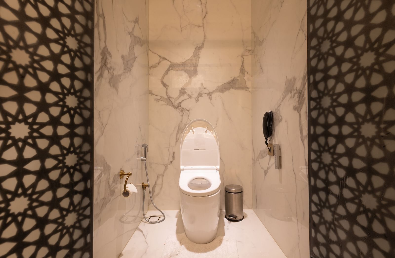 image of the bathroom focusing on the commode in the heritage rooms - The Claridges New Delhi