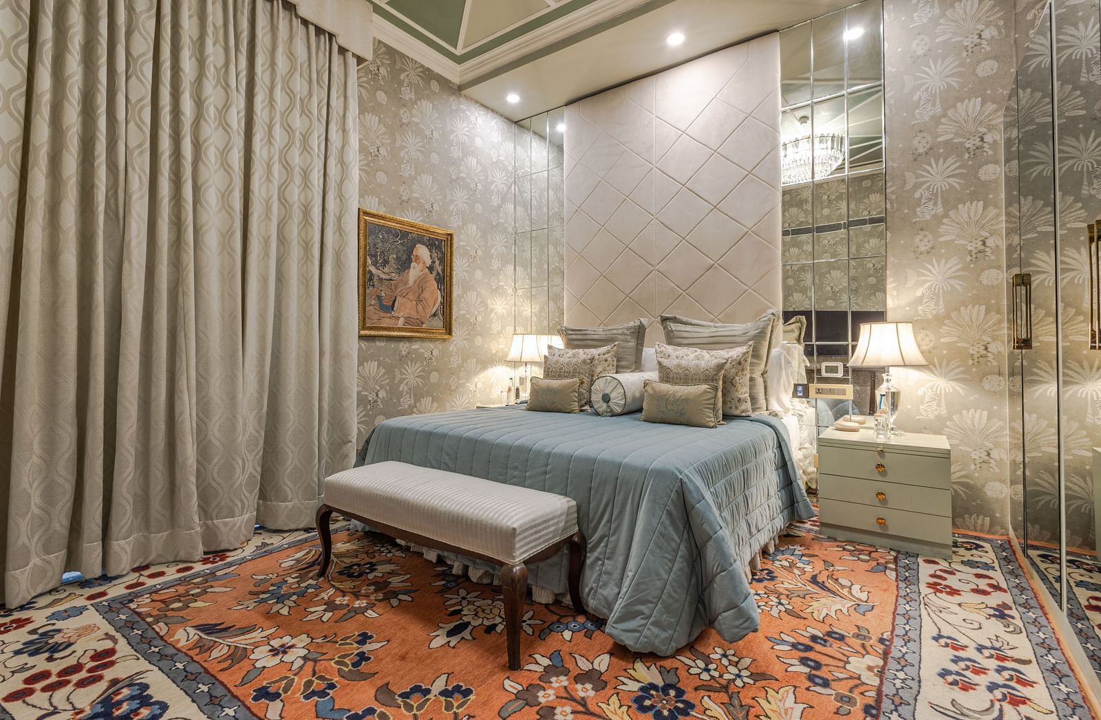 image of the spacious bedroom with plush bedding and long window curtains at our heritage luxury suite with whirlpool - The Claridges New Delhi