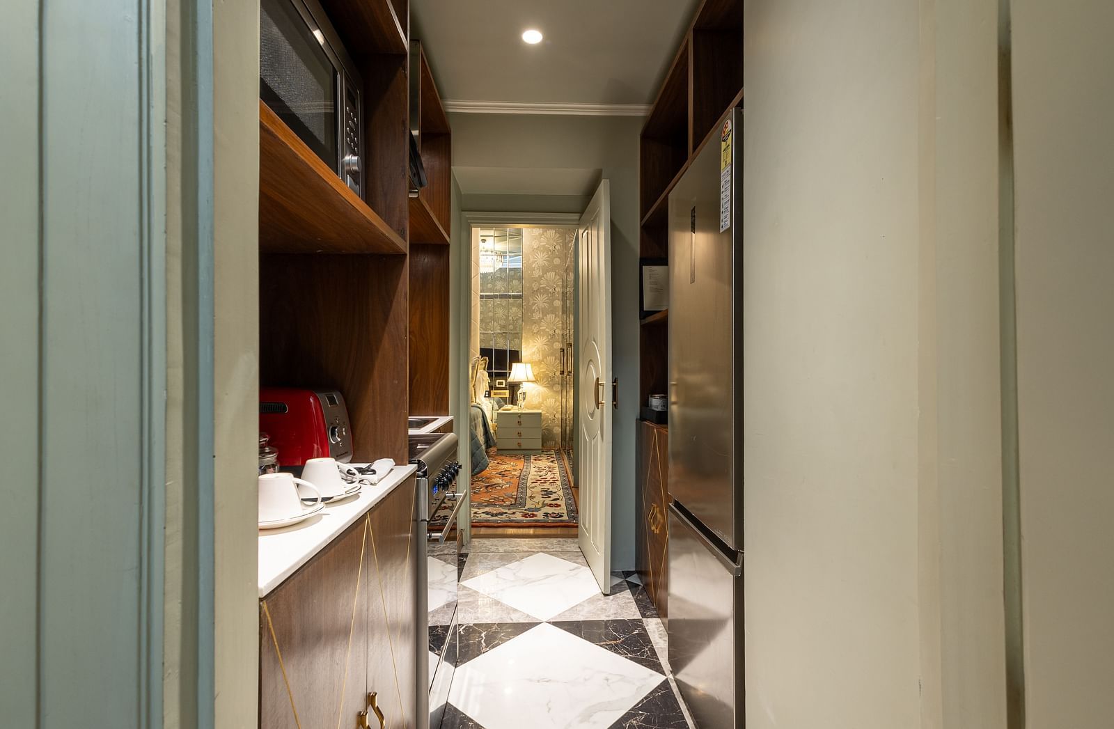image of a modern compact kitchenette in our heritage luxury suite with modern appliances - The Claridges New Delhi
