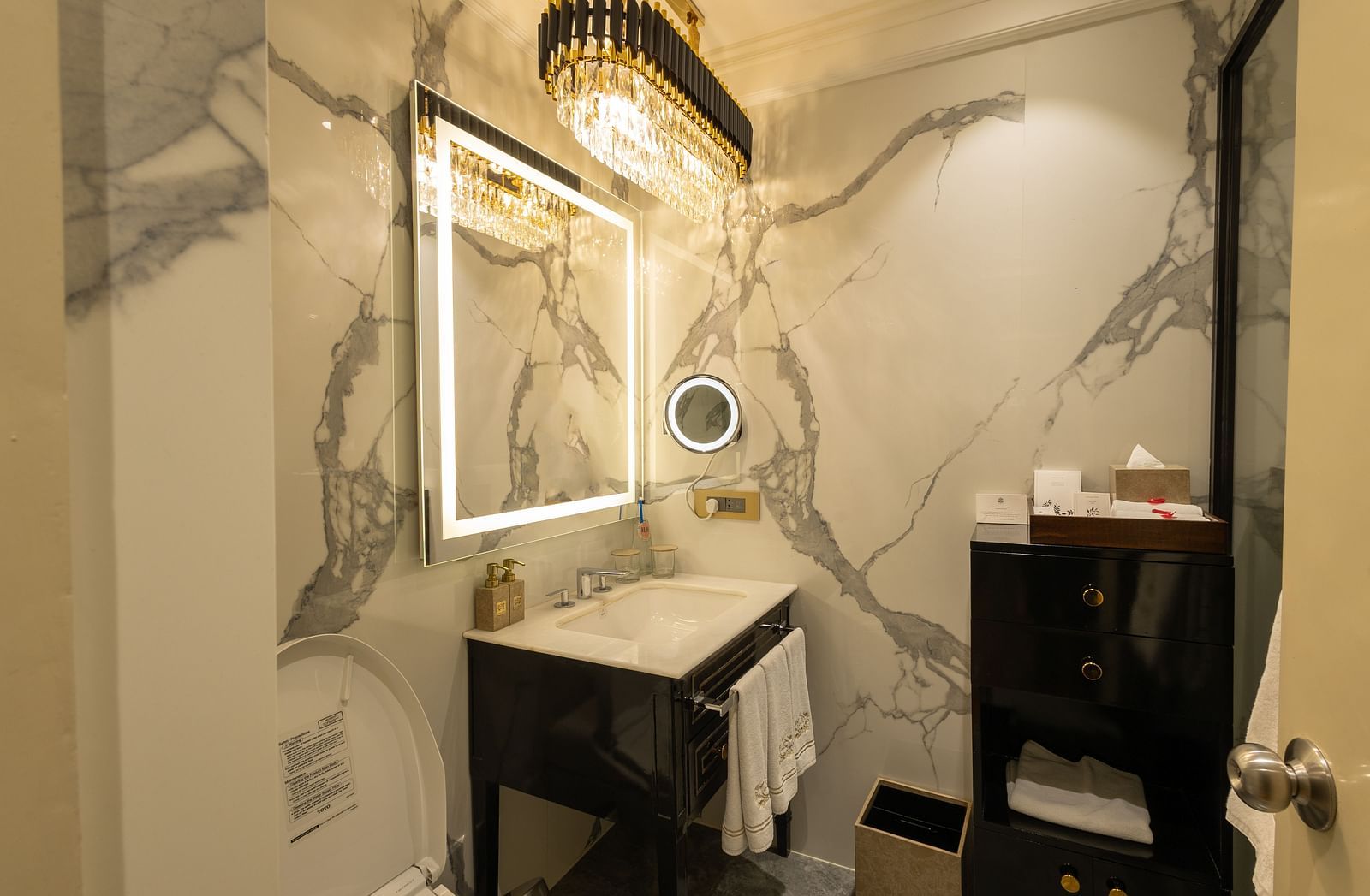 Superior Room washroom at The Claridges New Delhi, featuring a sleek sink and a wall-mounted mirror