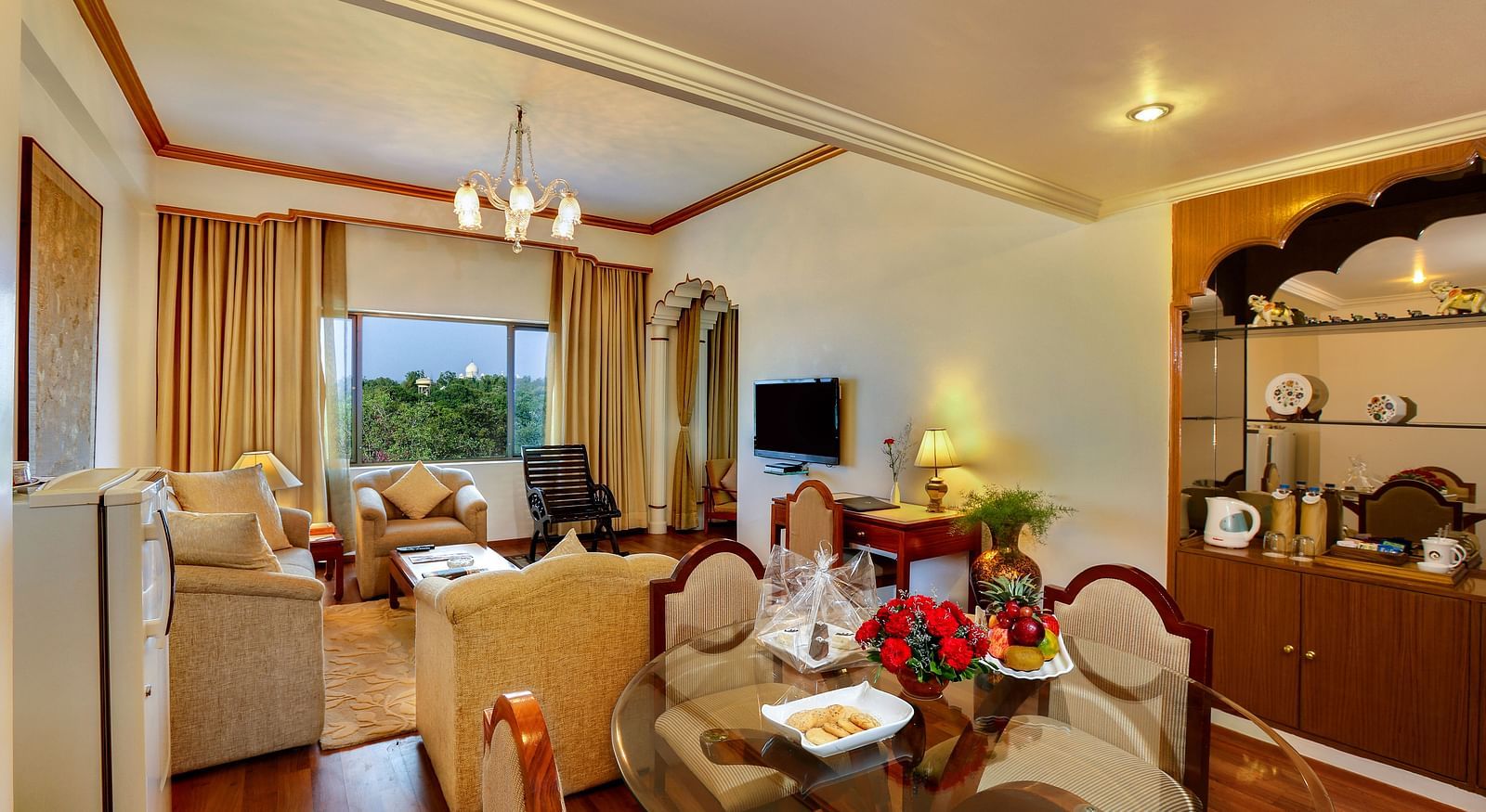 The Mumtaz Suite living area with a sofa and a dining table