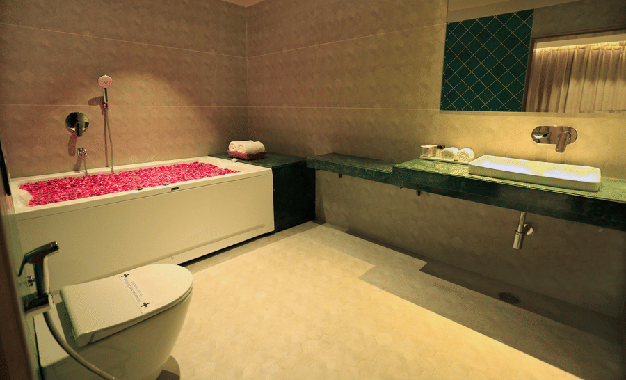 the bathtub filled with rose petals offered at the washroom of the suite - Hotel Bawa, Udaipur