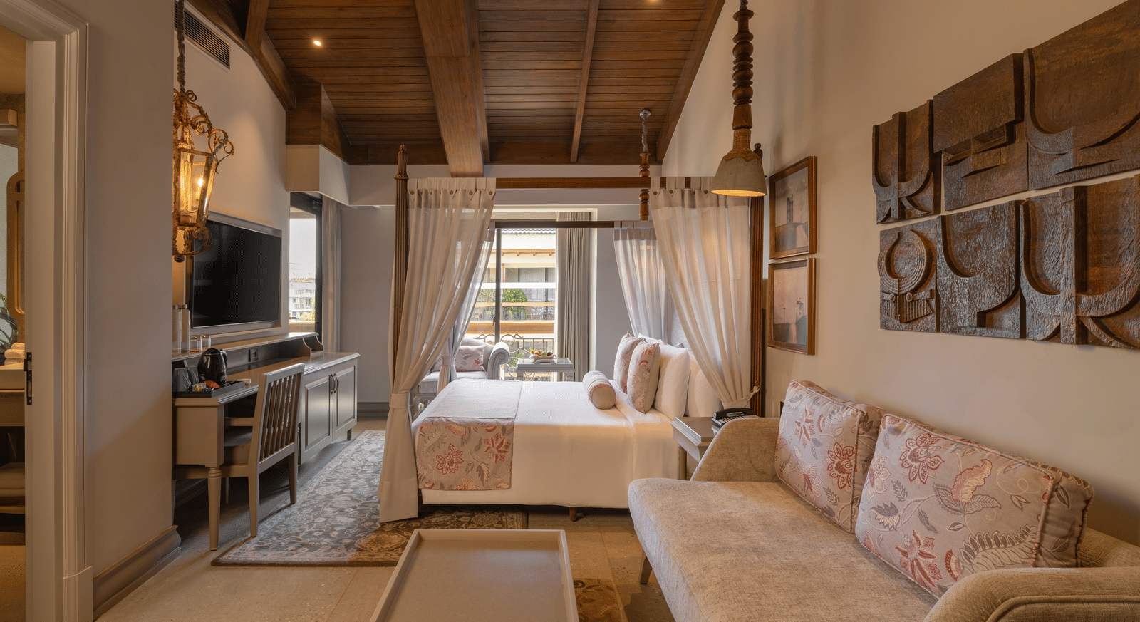 Side view of the Executive Room featuring a wooden ceiling and elegant furnishings at The Evren, Vagator.