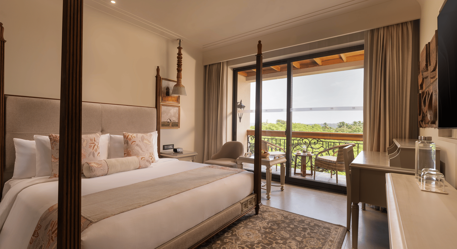 A corner-view shot of the Classic Room (Diwa) featuring a double bed along with a patterned rug placed in front of it at The Evren, Vagator.