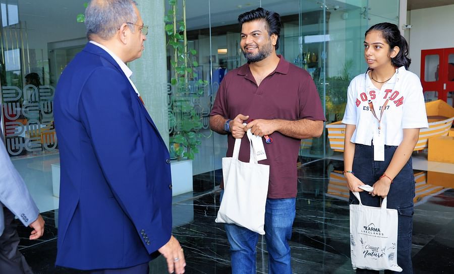 Guests interacting and receiving gift bags - Karma Lakelands.