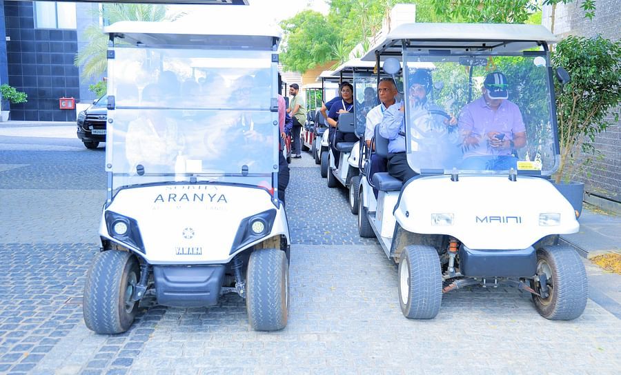 Picture featuring two golf cars in the day time - Karma Lakelands.
