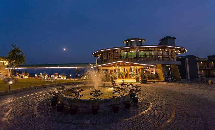alt-text Night view of a modern resort with fountain