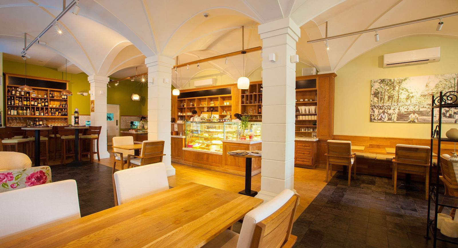 A view of an interior of a restaurant with tables and chairs | The Shop | Central Mansions, Phnom Penh