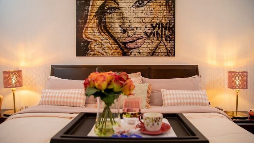 A well decorated room with a poster on the wall