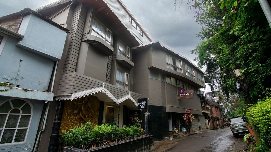 A facade image of Sumitel Vista TV Tower having lush greenery around