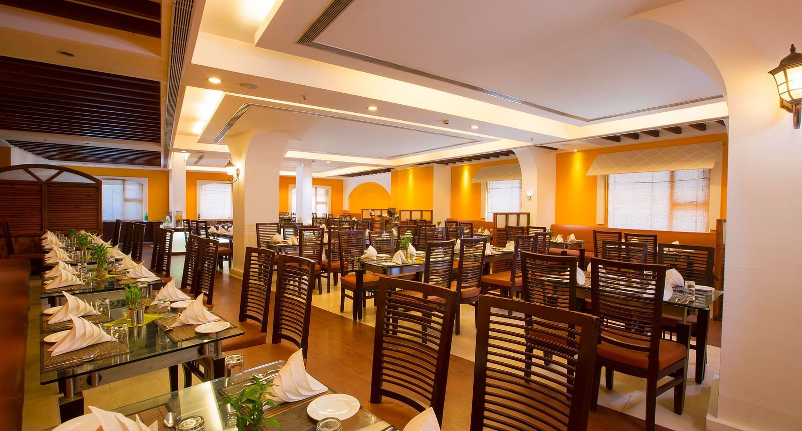 Le Boulevard featuring a dining table at Hotel Atithi - TGI Grand, Pondicherry