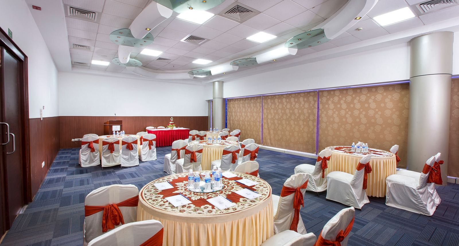 Centre Point at Hotel Atithi - TGI Grand, Pondicherry featuring round tables at chairs