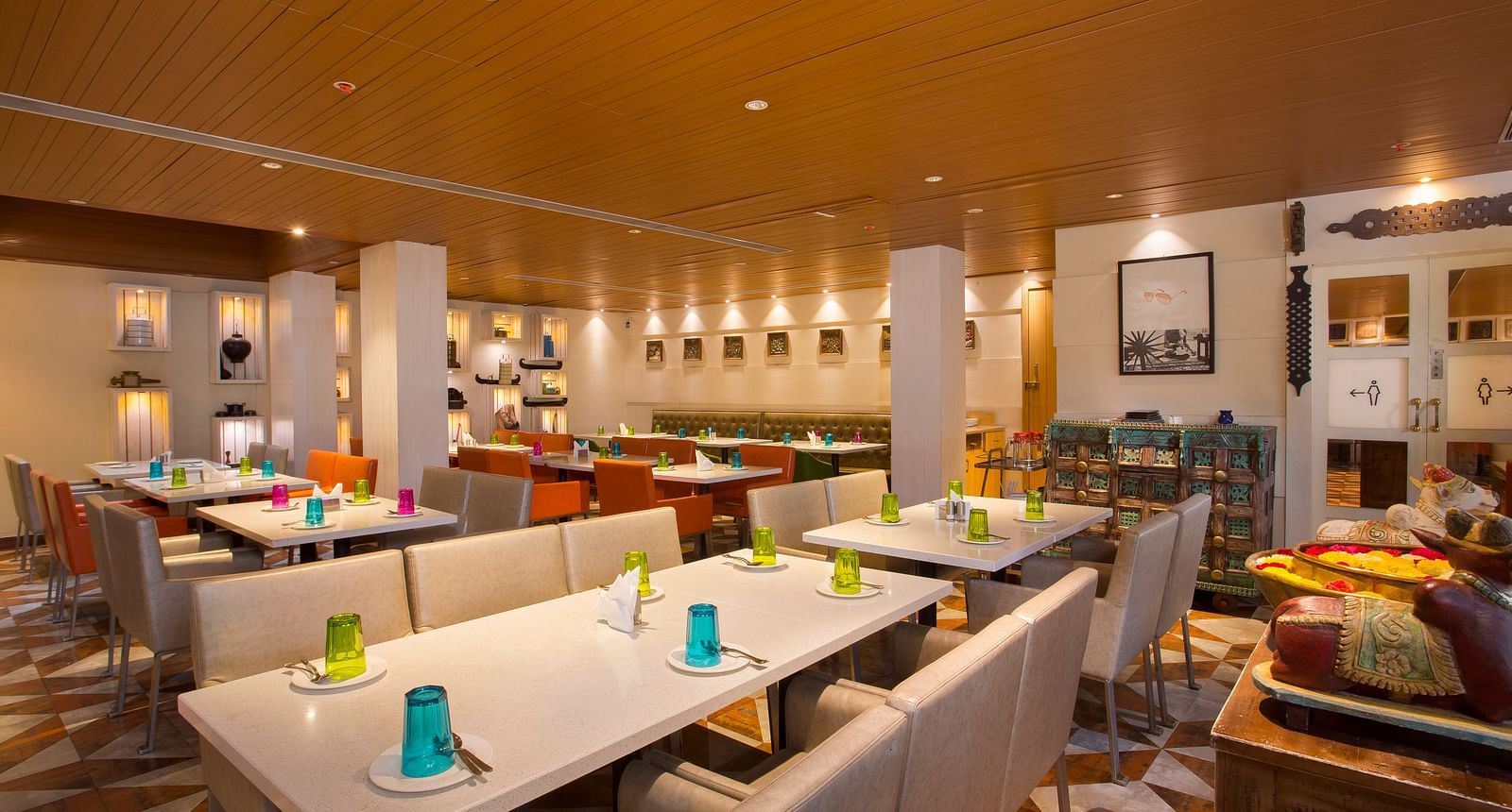 view of a restaurant with rows of rectangular tables with chairs on the long sides - Hotel Fountain Tree By TGI - JP Nagar, Bangalore