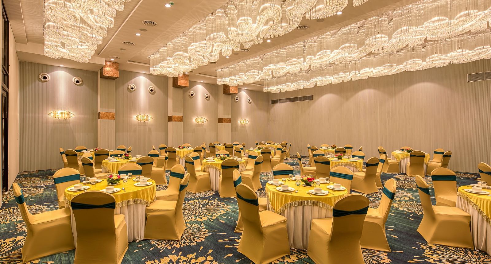 Yellow coloured chairs in the Sumo Anaika Banquet Hall at Le Foliage by TGI, Bangalore