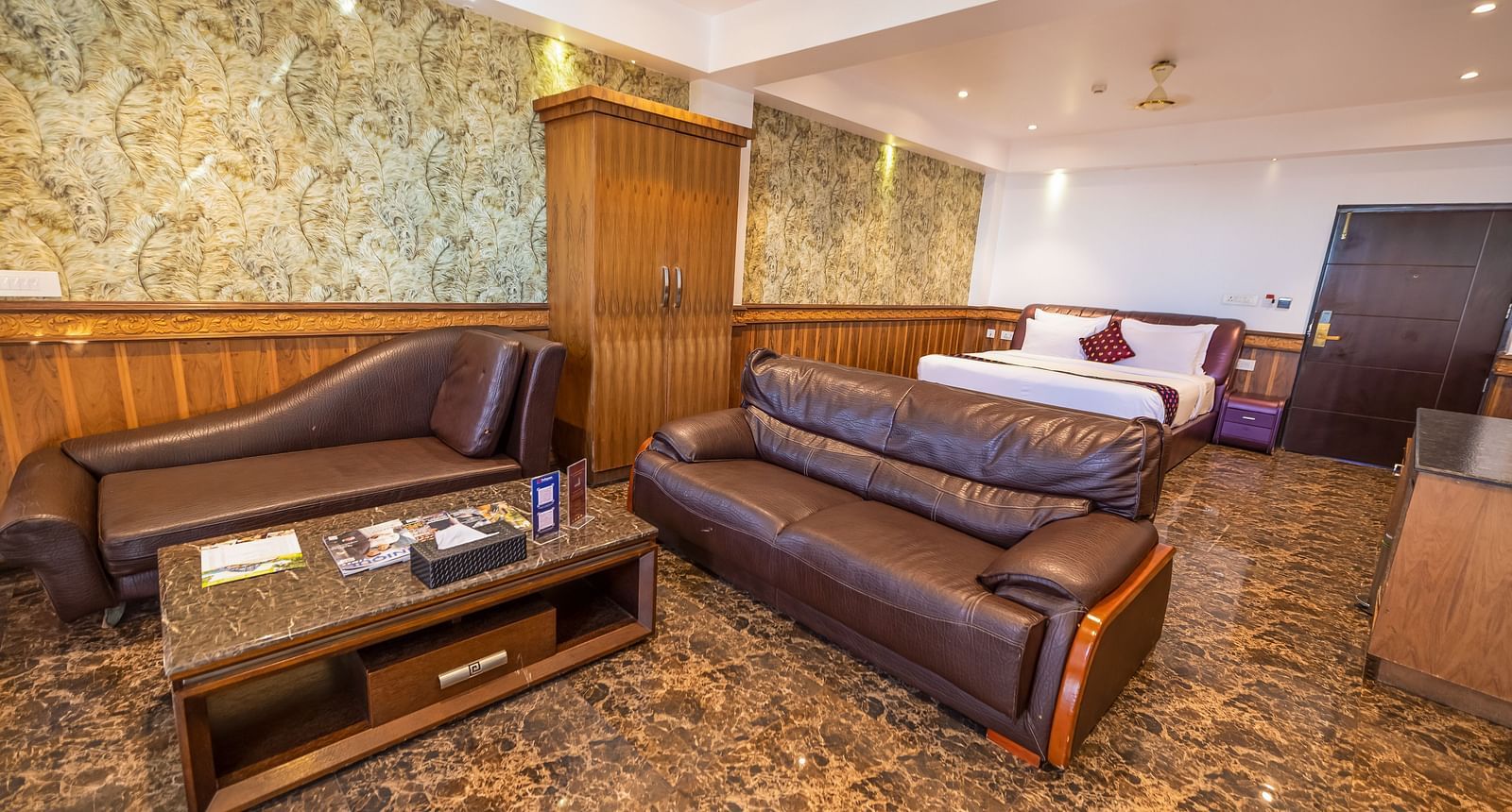 Two large sofas and a king size bed Inside the 90 Degree Club Suite at Parakkat Nature Hotel Resort Munnar 2