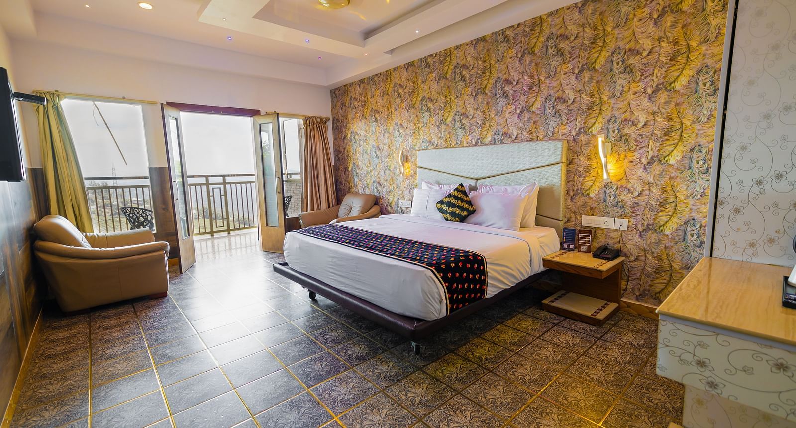 A double bed at the Premium Club Suite at Parakkat Nature Hotel and Resorts Munnar 3