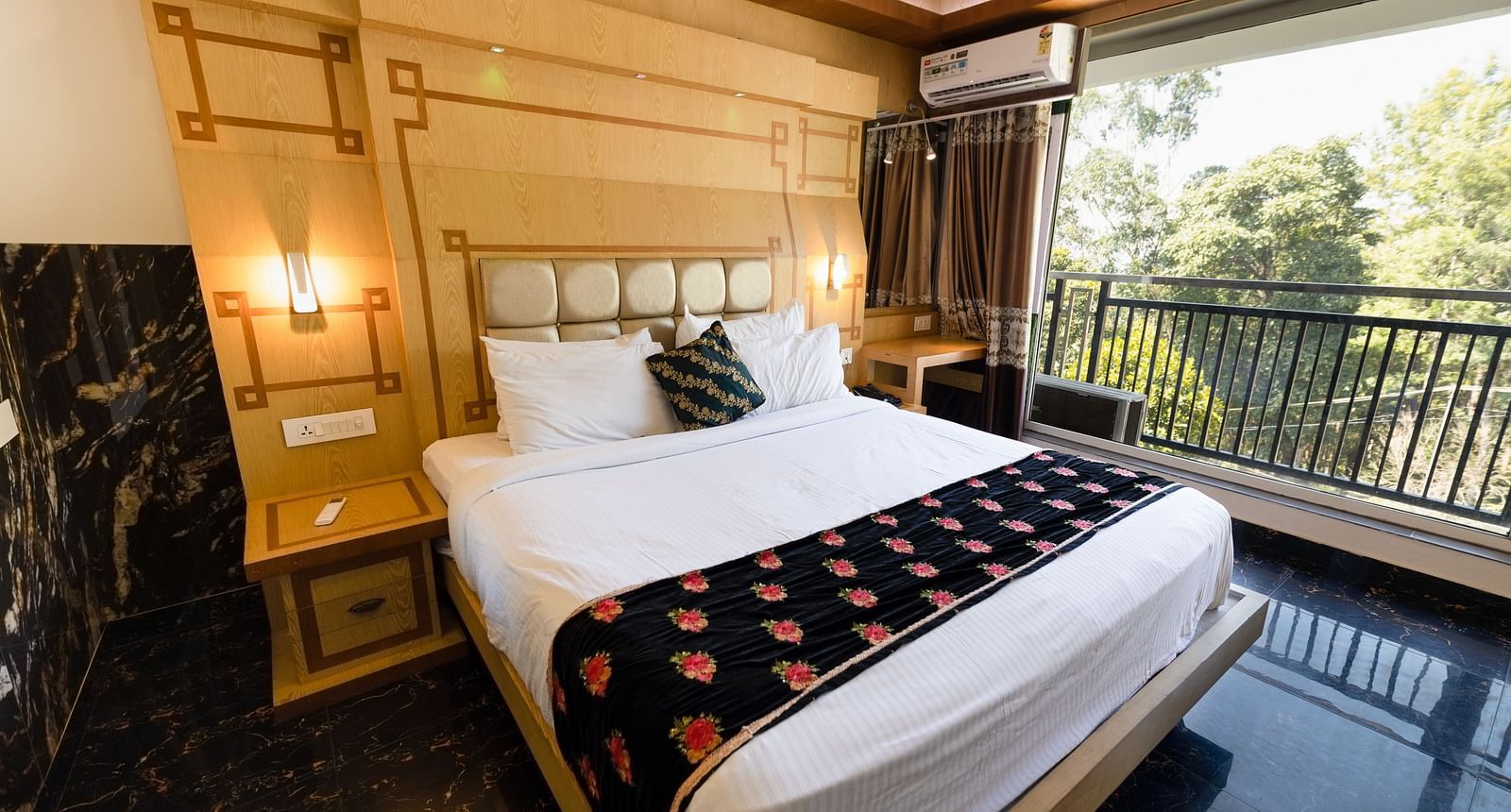 Wide view of the double bed in the Superior Room at Parakkat Nature Hotel and Resorts Munnar 1