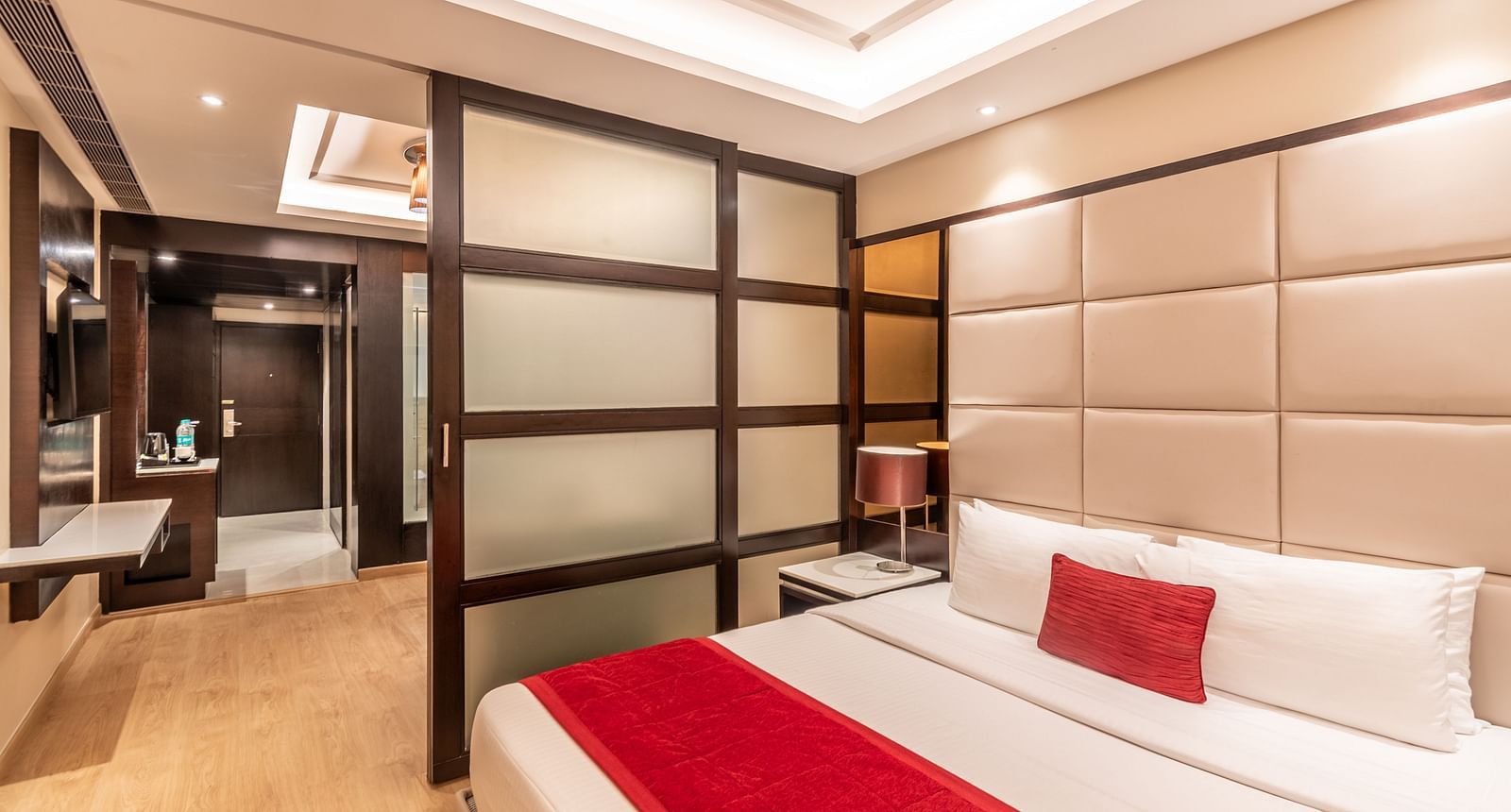 Fortuna suite view showing bed, wardrobe, and seating arrangement- TGI Grand Fortuna, Krishnagiri Main Road, Hosur