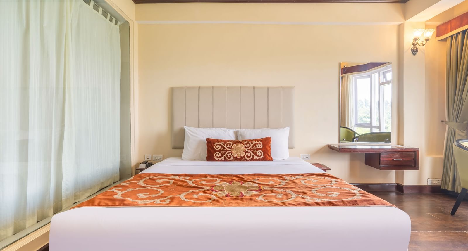 king size bed of premium room at Summit Lillium Hotel & Spa, Kalimpong