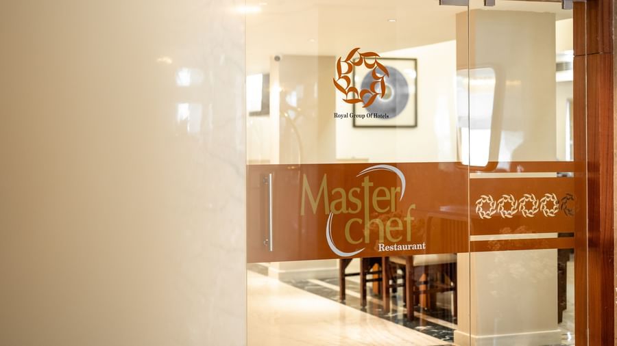 Entrance to Master Chef restaurant with glass door signage at Hotel Royal Regency Chennai