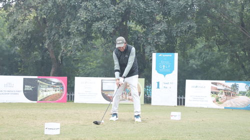 A man playing golf at the golf course on the game day  at Heritage Village Resorts & Spa