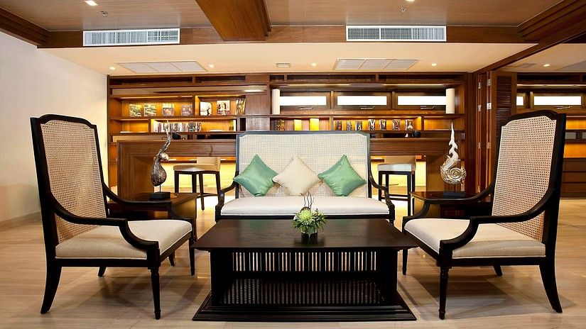 image of a common seating area with an expansive library in the background - Maikhao Dream Villa Resort & Spa, Phuket