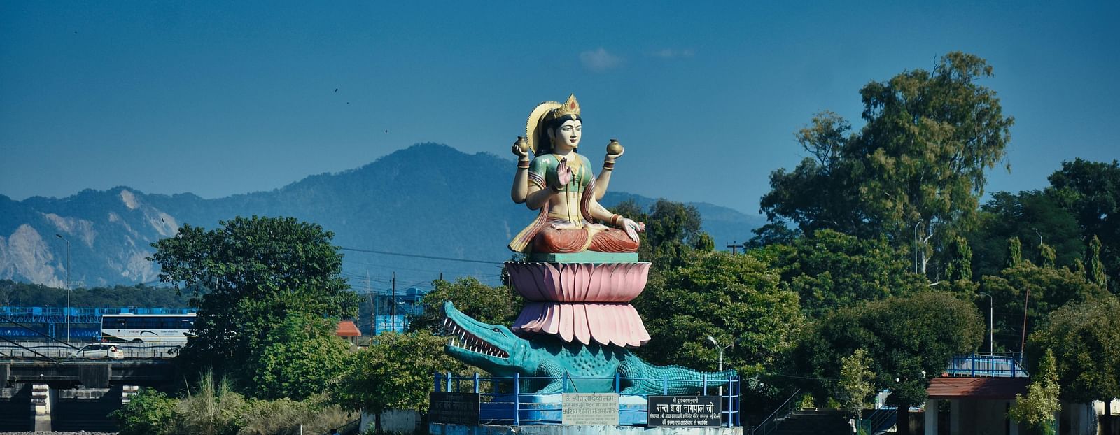 A majestic statue of Goddess Ganga, overlooking the river.