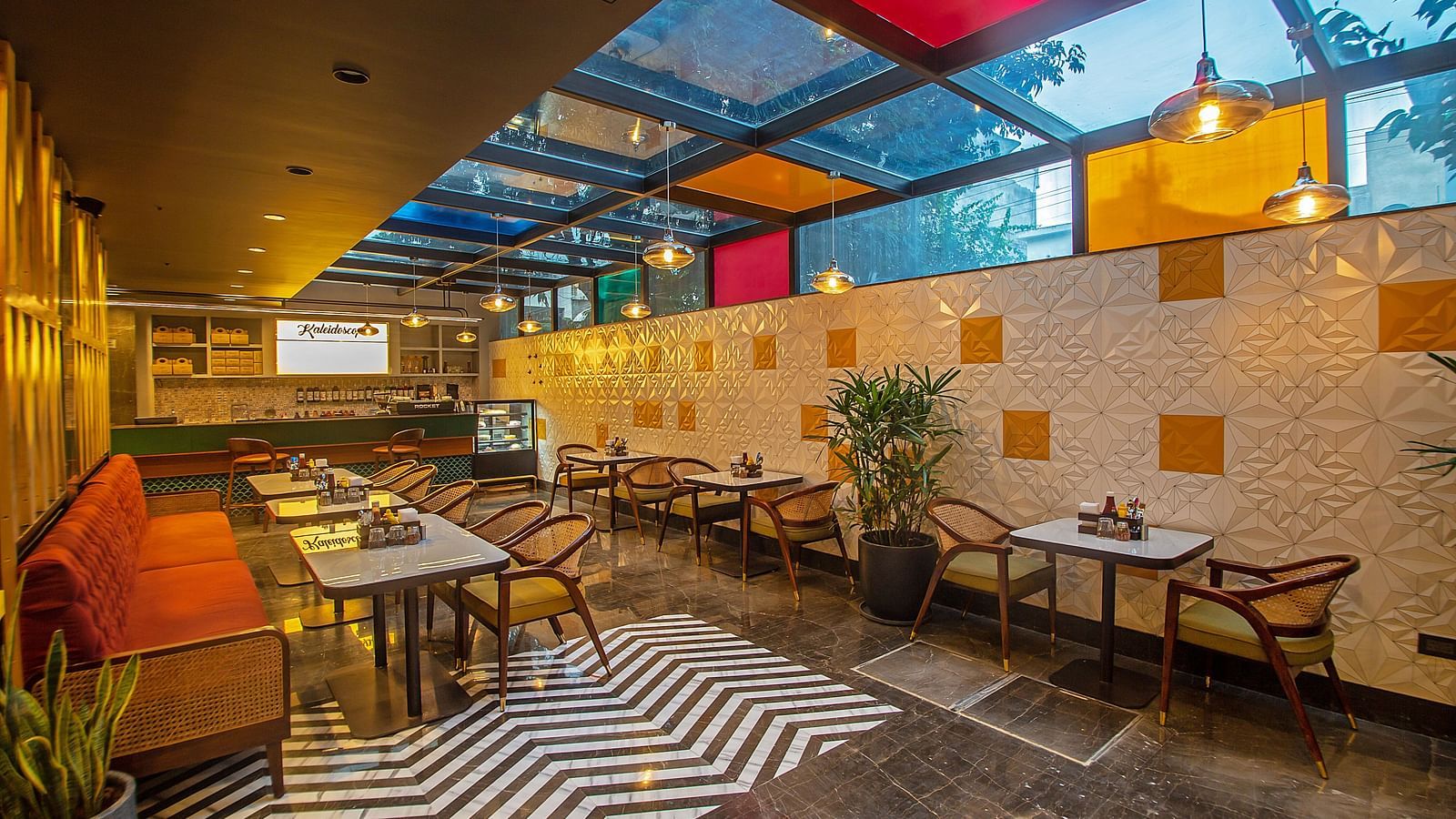 An image of a dining area with various seating arrangements including chairs, table, and sofa 