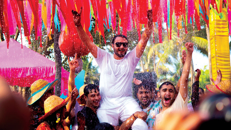 a person being kept on the shoulders of other people celebrating - Caravela Beach Resort Goa